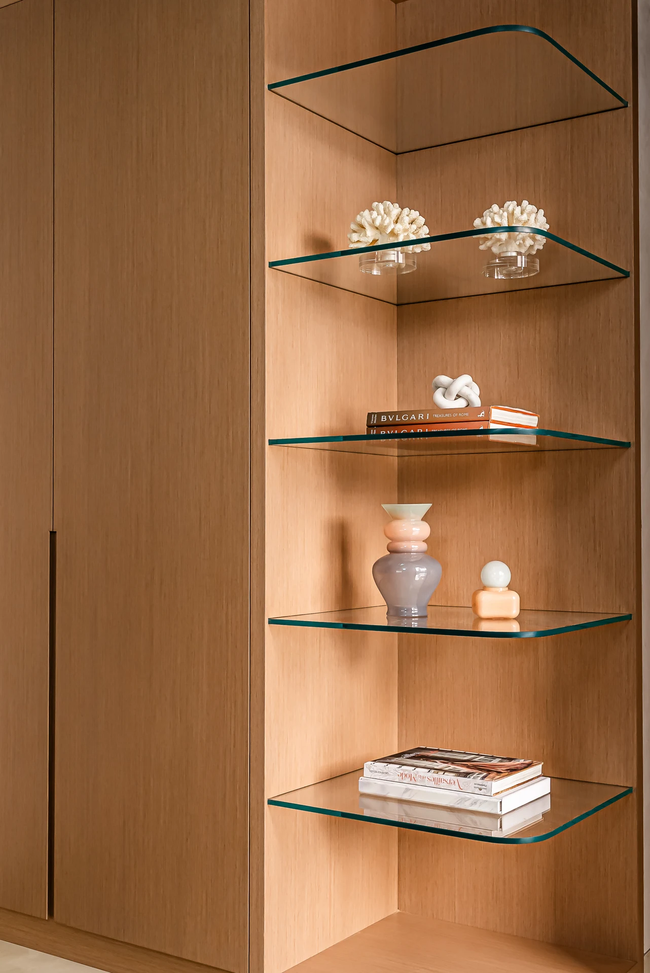 Amalfi Villa — Specially cut glass shelves are shaped to the joinery, creating a precise, weightless display.