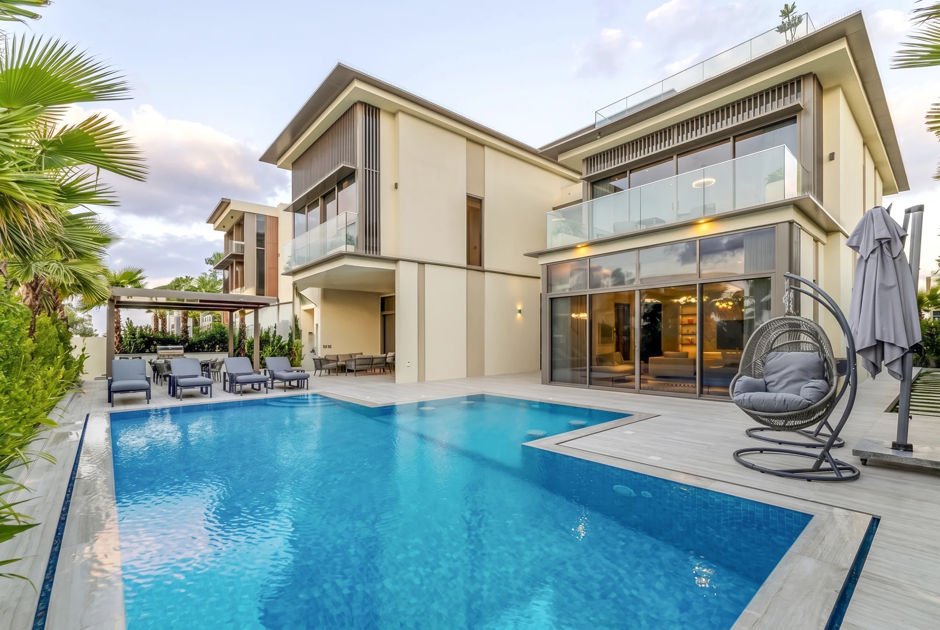Golf Place II Villa — A contemporary outdoor retreat featuring refined detailing, expansive poolside terraces and lush landscaping.