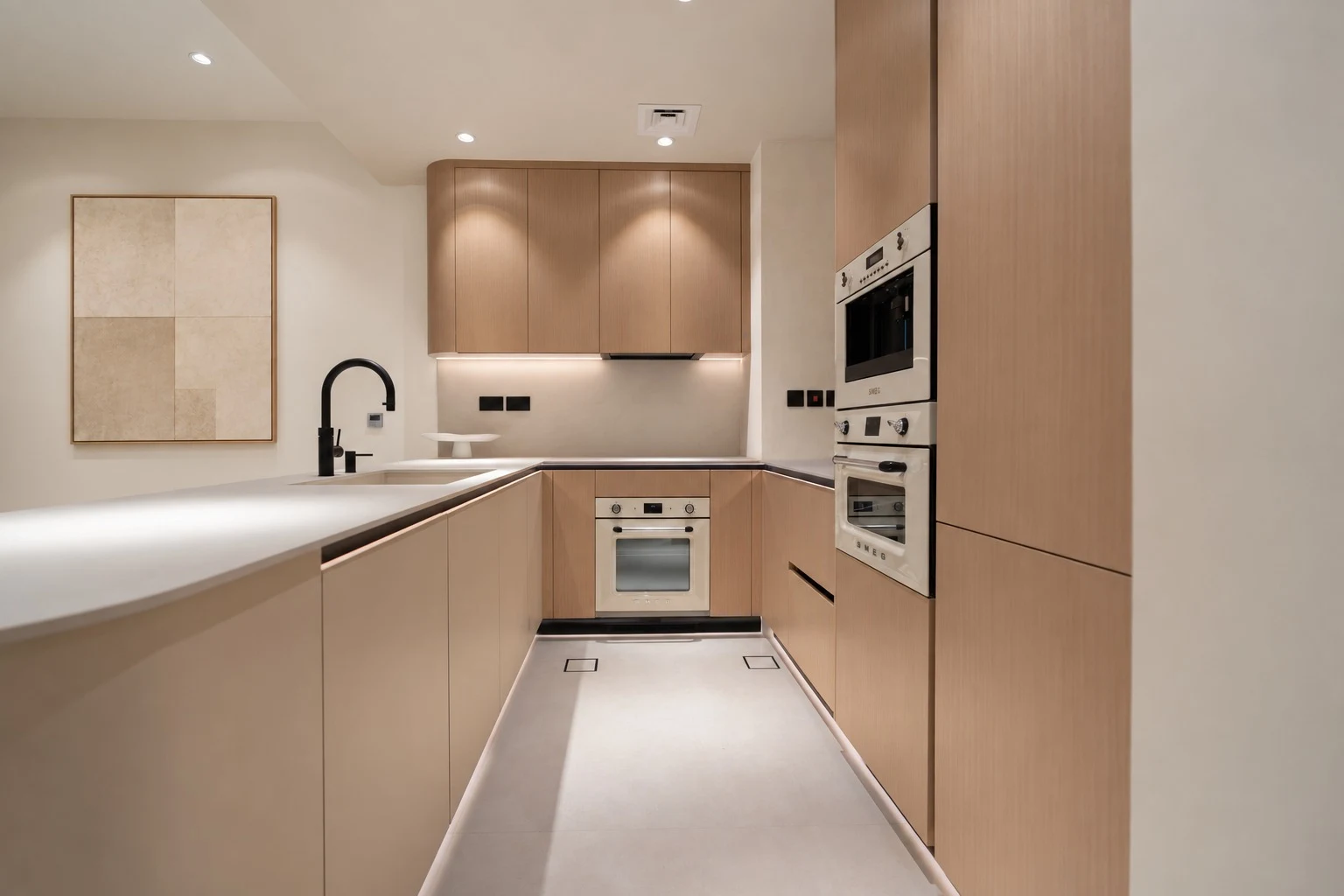 Maple Villa — Integrated task lighting traces the kitchen joinery, bringing precision and warmth to the work surfaces.