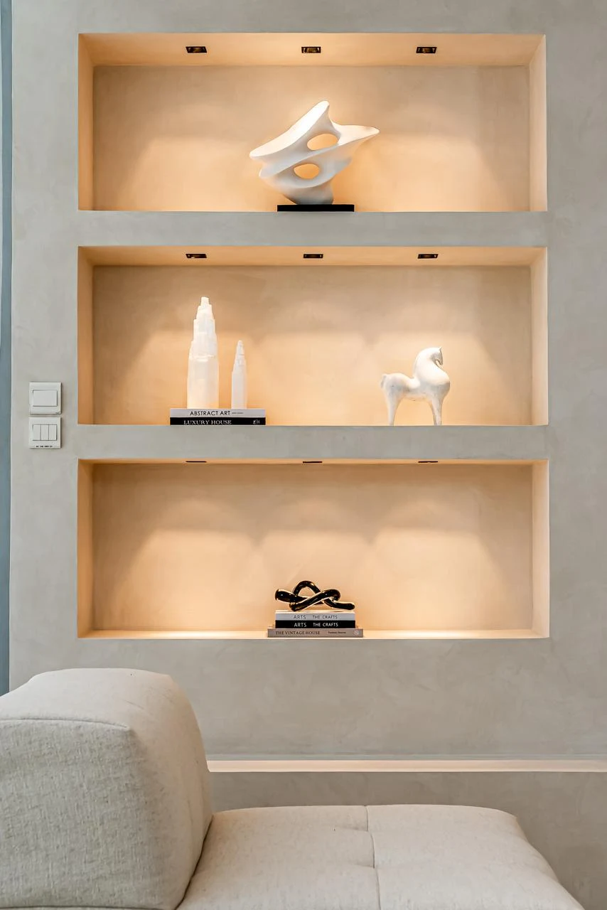 Amalfi Villa — Light concealed beneath each shelf brings a quiet warmth to the objects on display.